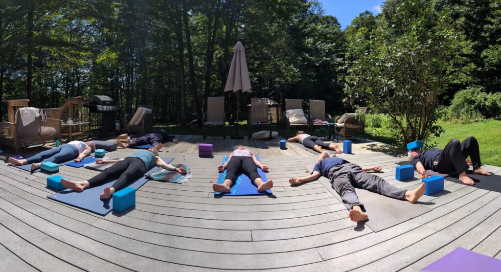 Savasana on the deck, in the sun of beautiful Western, MA